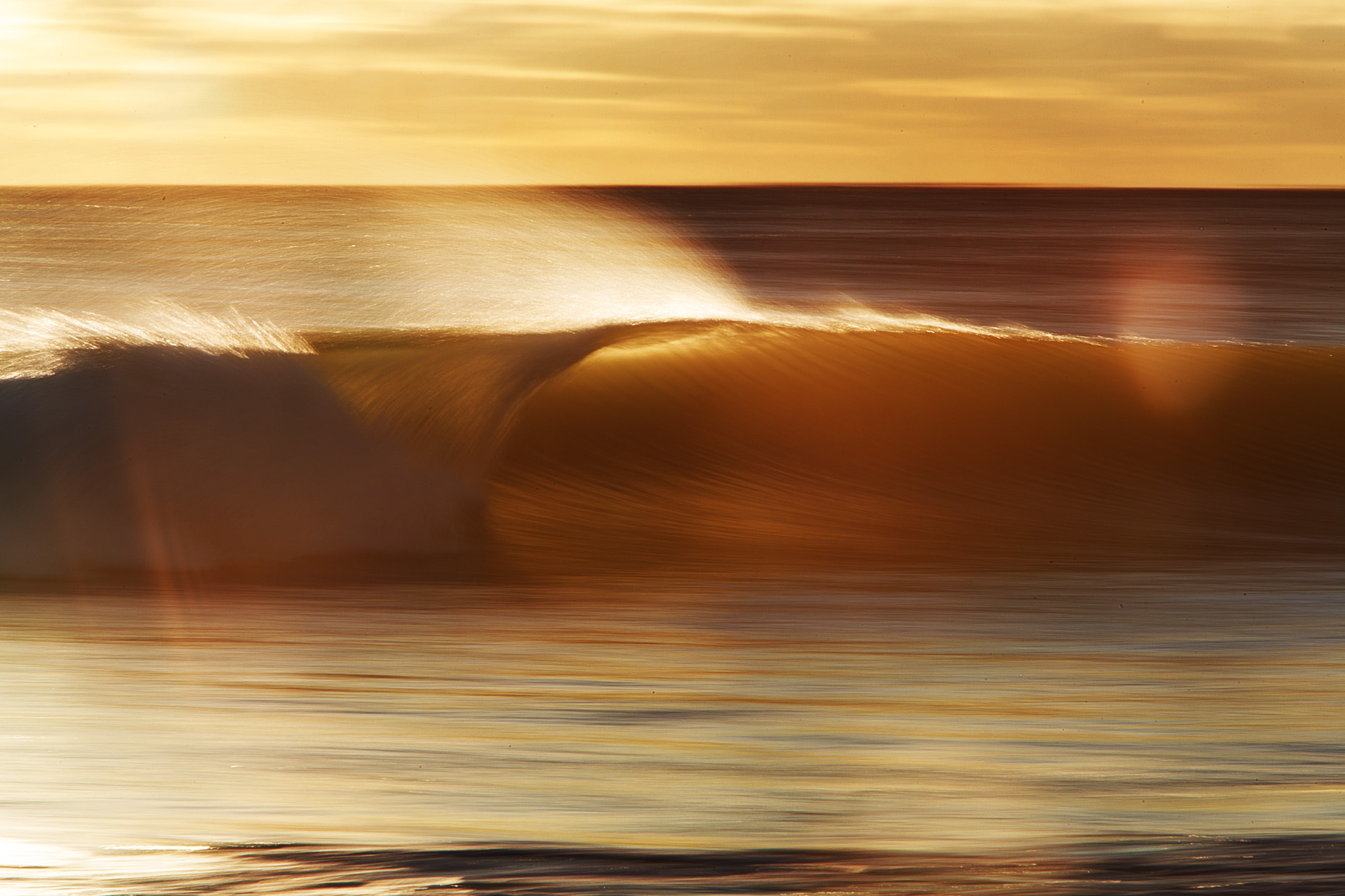 speed blur sunrise wave by New Hampshire based commercial outdoor lifestyle photographer Brian Nevins