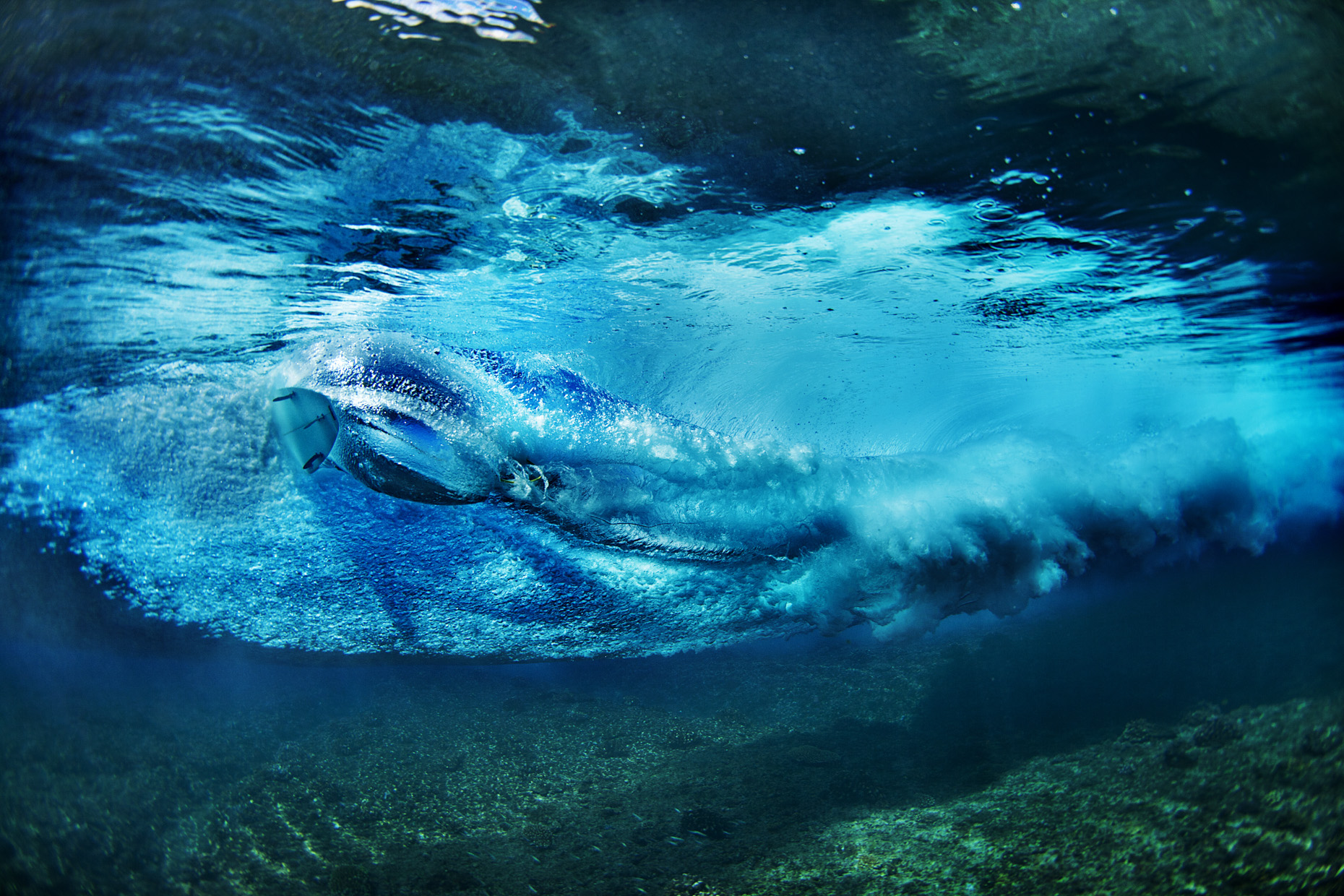 Underwater surfer in Indonesia by Boston based commercial sports photographer Brian Nevins