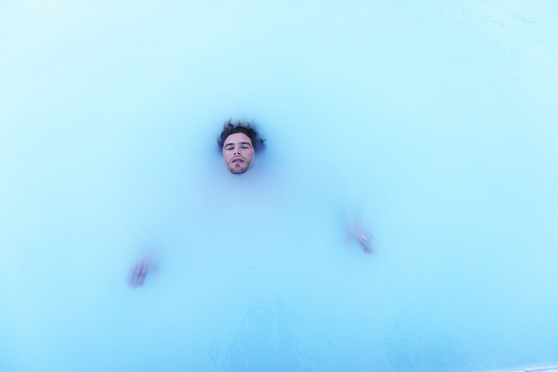 Jesse Hines in the Blue Lagoon in Iceland by Boston based commercial portrait photographer Brian Nevins